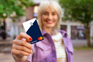 Woman showing MyFlex Credit Card